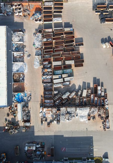 drone shot of a recycling yard with containers and sorted materials